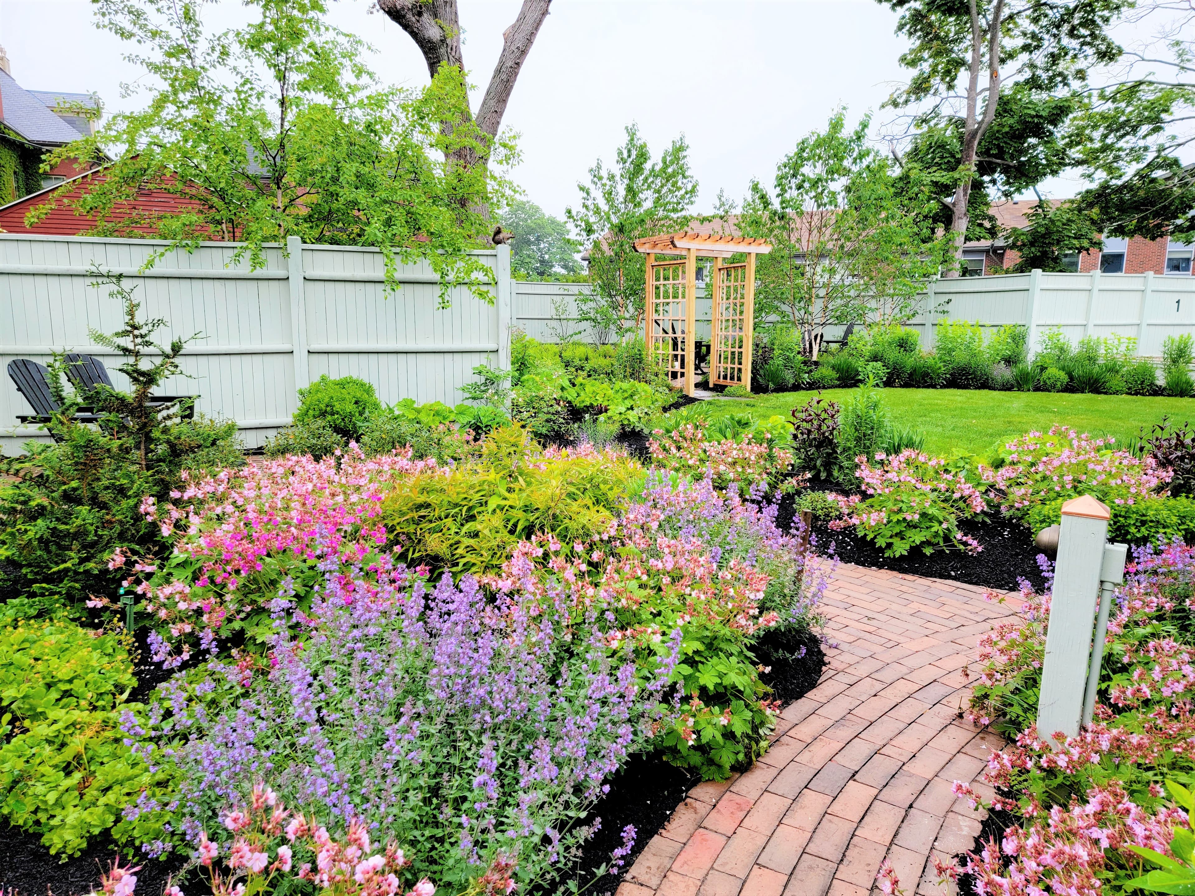 Brick Portland apartment entry with gardens